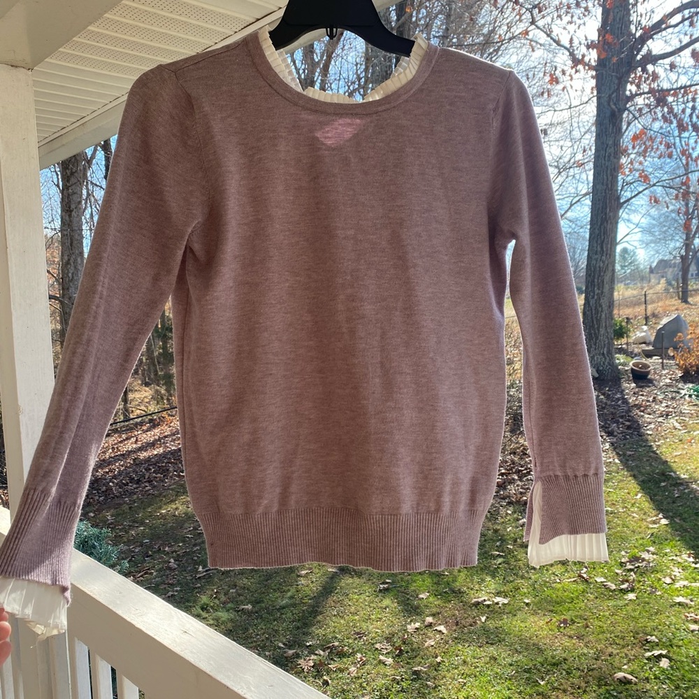 purple sweater with white underlining